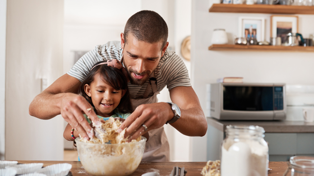 dad baking with daughter is a fun indoor activity for kids